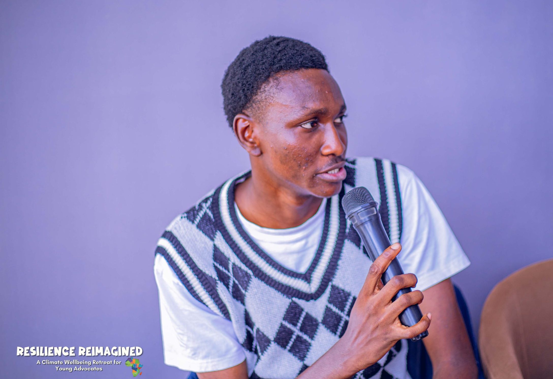 Young black man holding a microphone