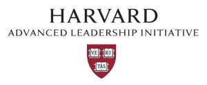 The logo for the Harvard Advanced Leadership Initiative, featuring the word "HARVARD" in a large black serif font at the top. Below it, the words "ADVANCED LEADERSHIP INITIATIVE" are written in a smaller black font. Centered at the bottom is the Harvard University shield, which is a dark red crest containing three open books with the letters "VE," "RI," and "TAS" across them.